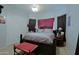 Traditional bedroom with a queen bed, carpet, bench and closet at 4609 W Challenger Trl, New River, AZ 85087