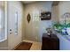 Inviting entryway with decorative door, neutral paint, and a view into the house at 4609 W Challenger Trl, New River, AZ 85087