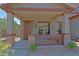 Inviting front porch with decorative security door, welcome sign, and ample light at 4609 W Challenger Trl, New River, AZ 85087