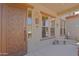 Inviting front porch with decorative security door, welcome sign, and ample natural light at 4609 W Challenger Trl, New River, AZ 85087
