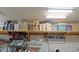 Garage shelves with stored items at 4609 W Challenger Trl, New River, AZ 85087