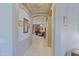 Hallway with tile flooring and a view into living room at 4609 W Challenger Trl, New River, AZ 85087