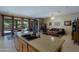 Open-concept kitchen with granite island, seamlessly connected to living room and patio at 4609 W Challenger Trl, New River, AZ 85087