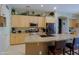 Eat-in kitchen featuring a large island, stainless appliances, and ample counter space at 4609 W Challenger Trl, New River, AZ 85087