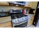 Modern kitchen featuring a stainless steel gas range and updated countertops at 4609 W Challenger Trl, New River, AZ 85087