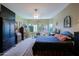 Comfortable main bedroom with large windows that provides backyard views and natural light at 4609 W Challenger Trl, New River, AZ 85087