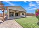 Landscaped backyard with covered patio and pergola at 4866 N 185-Th Dr, Goodyear, AZ 85395