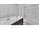 Bathroom featuring double sinks, a large mirror, and a shower/tub combo at 4866 N 185-Th Dr, Goodyear, AZ 85395