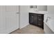 Bathroom with stylish vanity and dark cabinets at 4866 N 185-Th Dr, Goodyear, AZ 85395