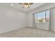 Bedroom with a ceiling fan, carpet, and a view of the landscape at 4866 N 185-Th Dr, Goodyear, AZ 85395