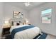 Inviting bedroom with a queen bed, stylish decor, and a serene atmosphere at 4866 N 185-Th Dr, Goodyear, AZ 85395