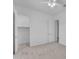 Bedroom featuring a ceiling fan, carpet flooring, closet, and adjacent ensuite at 4866 N 185-Th Dr, Goodyear, AZ 85395