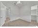 Carpeted bedroom featuring a ceiling fan, and adjacent bathroom with a shower at 4866 N 185-Th Dr, Goodyear, AZ 85395