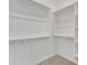 Walk-in closet features built-in shelving, ample storage, and carpeted floors at 4866 N 185-Th Dr, Goodyear, AZ 85395