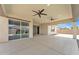 Spacious covered patio with ceiling fans and an open backyard at 4866 N 185-Th Dr, Goodyear, AZ 85395