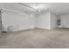Clean and spacious garage with a water heater and access door to the home's interior at 4866 N 185-Th Dr, Goodyear, AZ 85395