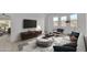 Bright living room filled with natural light boasts contemporary furnishings and a view to the outdoors at 4866 N 185-Th Dr, Goodyear, AZ 85395