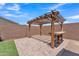 Backyard pergola with attached table at 4866 N 185-Th Dr, Goodyear, AZ 85395
