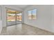 Bright room with sliding glass doors leading to a patio area at 4866 N 185-Th Dr, Goodyear, AZ 85395