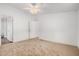 Spacious bedroom with neutral carpet, ceiling fan, and ample natural light at 544 S Crismon Rd, Mesa, AZ 85208