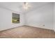 Comfortable bedroom with neutral carpet, window view and simple design at 544 S Crismon Rd, Mesa, AZ 85208
