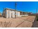 Exterior view featuring gravel landscaping, cinder block walls, and enclosed patio at 544 S Crismon Rd, Mesa, AZ 85208