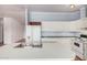 Well-lit kitchen with white countertops, stainless steel sink, and modern appliances at 544 S Crismon Rd, Mesa, AZ 85208