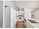 Functional kitchen featuring white cabinets, modern appliances, and a convenient layout at 544 S Crismon Rd, Mesa, AZ 85208