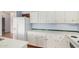 Bright kitchen featuring white cabinets and countertops, complemented by modern appliances at 544 S Crismon Rd, Mesa, AZ 85208