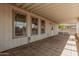 Enclosed patio featuring tiled floors and views of the backyard at 544 S Crismon Rd, Mesa, AZ 85208