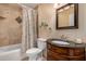 Charming bathroom with vanity, sink, and shower featuring designer tile accents at 5744 E Oak St, Scottsdale, AZ 85257
