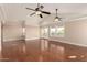Bright bedroom showcasing hardwood floors, and multiple windows with natural light at 5744 E Oak St, Scottsdale, AZ 85257