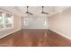 Spacious bedroom featuring hardwood floors, natural light, and ceiling fans at 5744 E Oak St, Scottsdale, AZ 85257