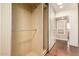Walk-in closet with natural wood walls, shelving and a view of bedroom at 5744 E Oak St, Scottsdale, AZ 85257