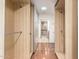 Spacious walk-in closet with wooden shelving and open design at 5744 E Oak St, Scottsdale, AZ 85257