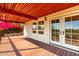 Relax on this covered wood deck with beautiful landscaping and French doors at 5744 E Oak St, Scottsdale, AZ 85257
