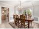 Elegant dining room with a chandelier, coffered ceiling, and large windows, providing ample natural light for dining at 5744 E Oak St, Scottsdale, AZ 85257