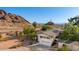Aerial view of the home showcasing the large backyard and mountain views at 5744 E Oak St, Scottsdale, AZ 85257