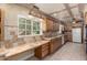 Bright kitchen with large window above the sink and built-in desk with drawers at 5744 E Oak St, Scottsdale, AZ 85257
