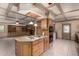 Spacious kitchen with modern appliances and wooden cabinets leading into an adjacent room at 5744 E Oak St, Scottsdale, AZ 85257