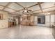 Spacious kitchen with a coffered ceiling, tile floors, wooden cabinets, and modern appliances at 5744 E Oak St, Scottsdale, AZ 85257