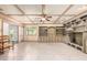 Bright living room featuring tile floors, built-in shelves, and large windows for natural light at 5744 E Oak St, Scottsdale, AZ 85257