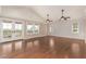 Large living room with hardwood floors, lots of windows, and french doors to the outside at 5744 E Oak St, Scottsdale, AZ 85257