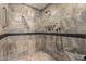 Shower with tiled walls, a shower head, and a handle at 5744 E Oak St, Scottsdale, AZ 85257