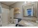 Clean bathroom featuring a granite vanity, a toilet, and a shower-tub combination at 5911 E Evergreen St, Mesa, AZ 85205