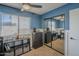 Bedroom with a stylish built-in closet, decor and bright blue painted walls at 5911 E Evergreen St, Mesa, AZ 85205