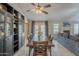 Spacious dining area with tile floors and large wooden table, perfect for Gathering meals and entertaining at 5911 E Evergreen St, Mesa, AZ 85205