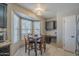 Charming breakfast nook with a dining table, tile floors, and large bay windows for natural light at 5911 E Evergreen St, Mesa, AZ 85205