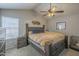 Spacious main bedroom featuring vaulted ceilings, a ceiling fan, and stylish decor for a relaxing retreat at 5911 E Evergreen St, Mesa, AZ 85205