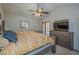 Main bedroom featuring a ceiling fan, nice decor and French doors leading to the backyard at 5911 E Evergreen St, Mesa, AZ 85205